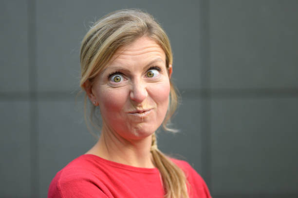 istock Charismatic blond woman with wide staring eyes 1198037872