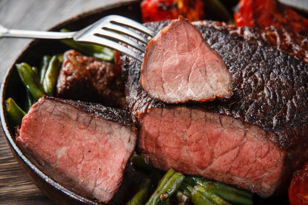 istock Marble beef steak in a cast iron skillet 1198037897