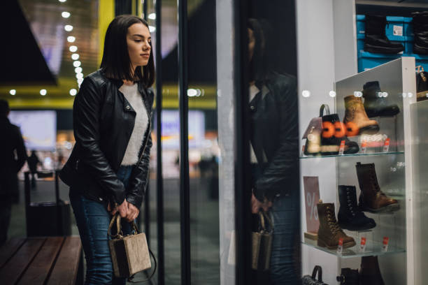 istock Young woman in shopping 1198037911