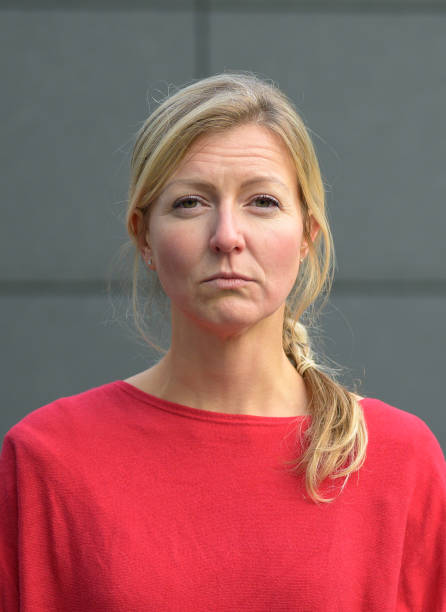 istock Vengeful woman slitting her eyes at camera 1198038622