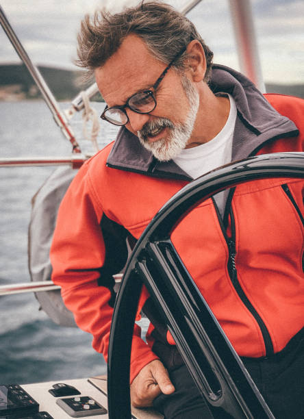 istock Skipper sailing on sailboat 1198039686
