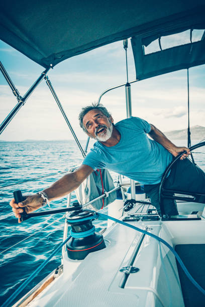 istock Skipper sailing on sailboat 1198039720
