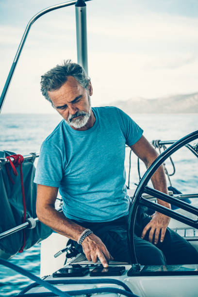 istock Skipper sailing on sailboat 1198039754