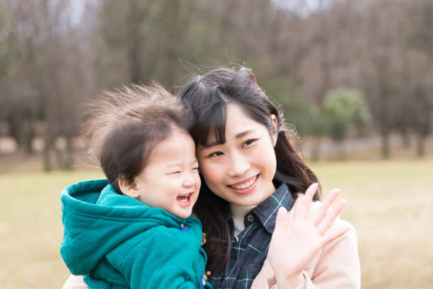istock Child held by her mother 1198042633