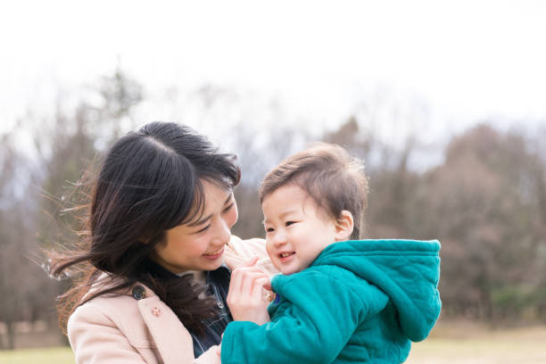 istock Child held by her mother 1198042863