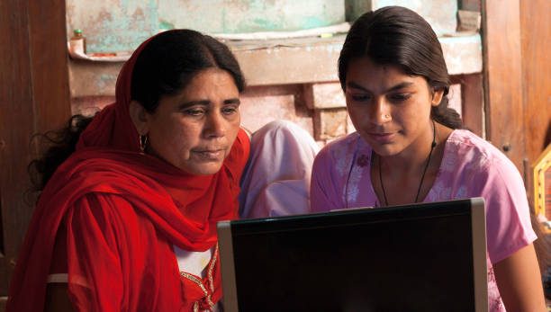 istock Parents Using Laptop at home with younger Daughter. 1198044231