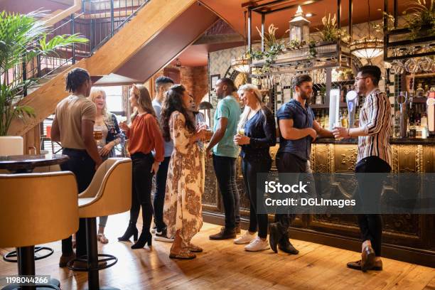 A Drink Before Lunch Stock Photo - Download Image Now - Bar - Drink Establishment, People, Restaurant