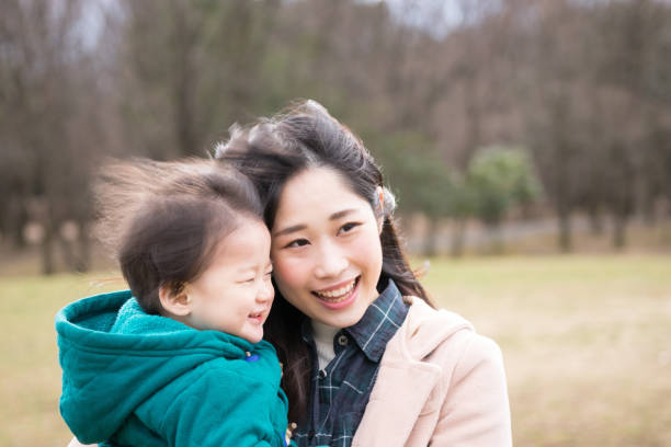 istock Child held by her mother 1198044334