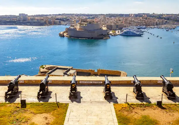 Photo of Fort St. Angelo in Birgu and the saluting battery at Barakka gardens