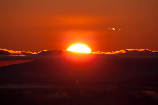 istock sun at sunset in the mountains 1198047706