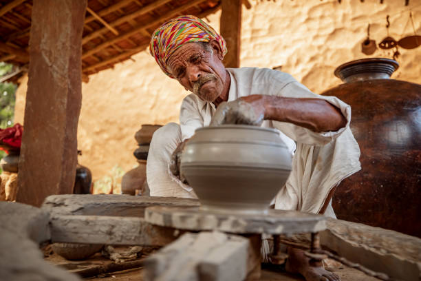 istock Potter at work makes ceramic dishes. India, Rajasthan. 1198047829