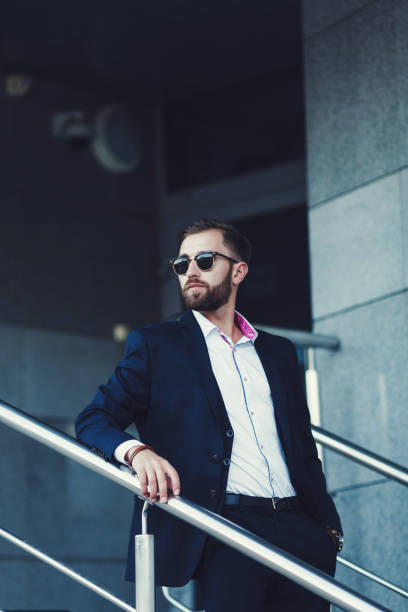 istock Businessman in suit and sunglasses 1198048699