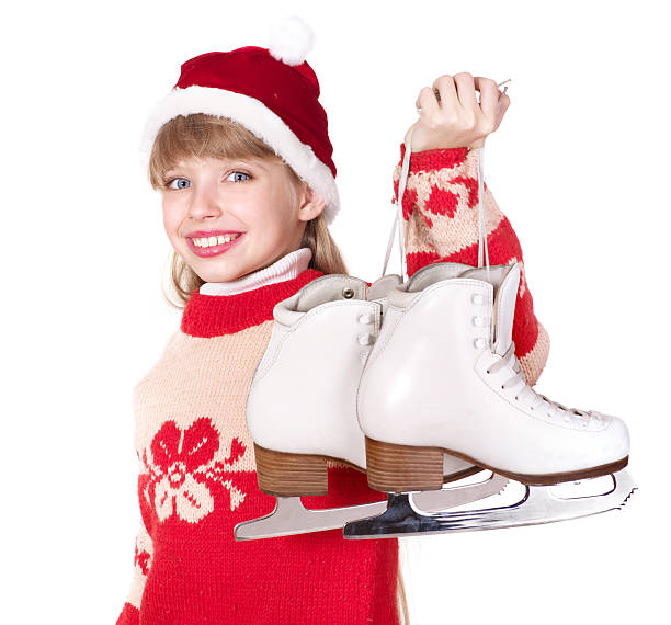 istock Child in santa hat holding figure skates. 119804870