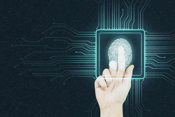 istock Digital security concept with human finger pushing digital fingerprint in microchip at abstract background. 1198049124