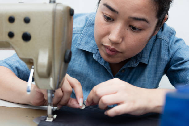 istock young asian woman sewing at seamstress workshop 1198049970