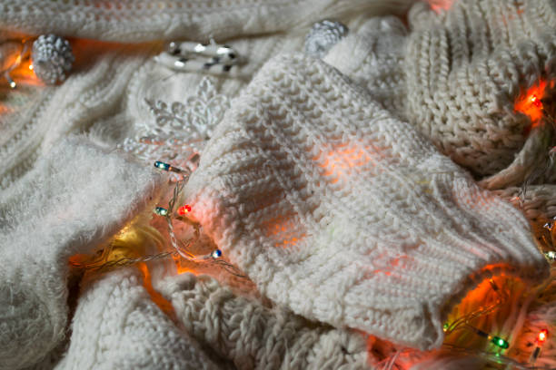 istock White knitted texture with decor. Soft clothes. Winter season. 1198054709