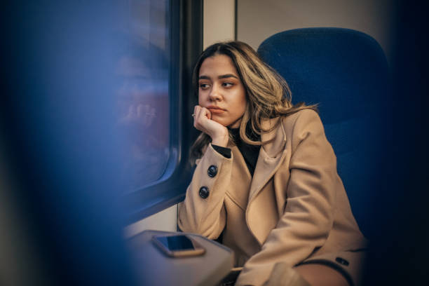 istock Elegant young woman is riding in a train 1198056739