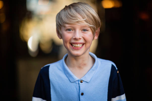 Smiles All Around A portrait of a boy smiling while looking at the camera. little boys blue eyes blond hair one person stock pictures, royalty-free photos & images