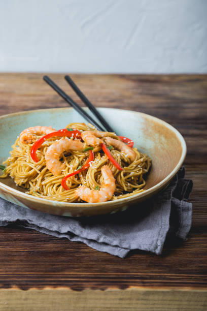 istock Egg noodles with bell pepper and shrimp 1198057830