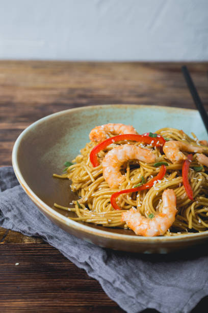 istock Egg noodles with bell pepper and shrimp 1198058726