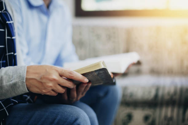 istock Christian friend reading bible together 1198058831