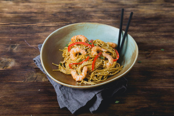 istock Egg noodles with bell pepper and shrimp 1198059131