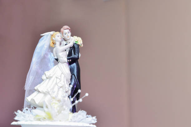 istock Wedding decorations bride and groom dolls holding bouquet.Wedding decorations are considered as one of the most noticeable attractions of the wedding day 1198059154