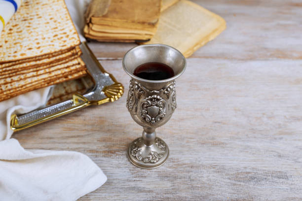 istock Pesah holiday celebration, matza unleavened bread and cup kosher wine 1198059236