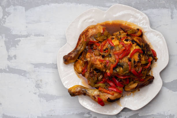 istock roasted chicken with herbs and vegetables on white dish 1198060319