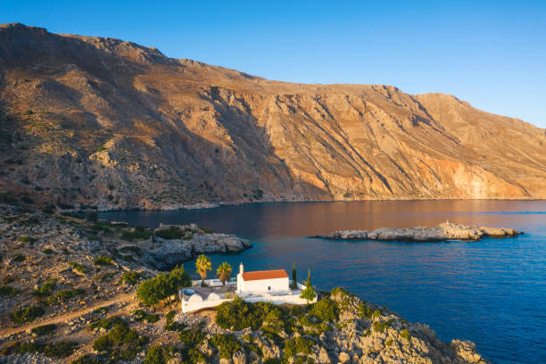 Idyllic small church in Loutro bay at sunset (south Rethymno, Crete, Greece).
