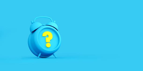 istock Blue Alarm Clock and Yellow Question Mark  on Blue Background 1198063950