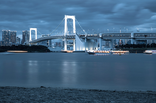 Tokyo downtown skyline and Rainbow Bridge at night