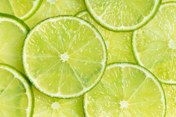 istock Perfect green lime slices close up 1198065118