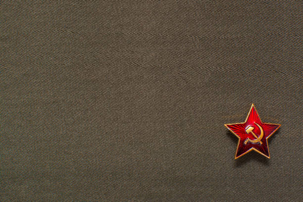 istock Military soviet star with hammer and sickle on fabric background 1198066052