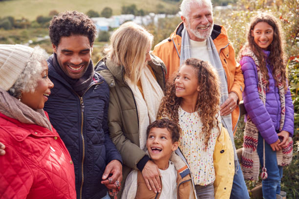 istock Active Multi-Generation Family On Winter Beach Vacation Resting By Gate 1198066205