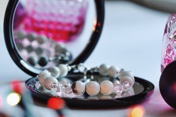 istock Jewelry composition with reflections in mirror with bokeh 1198067559