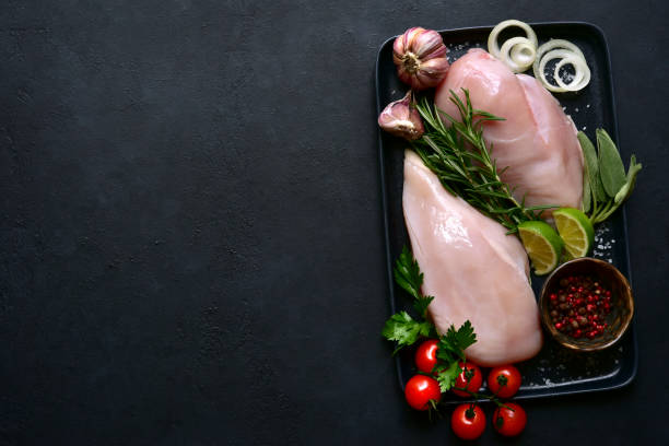 istock Fresh raw organic chicken breasts with spices 1198071638