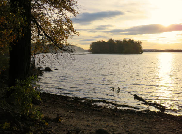 istock View by the shore of a sunset on the river 1198074846