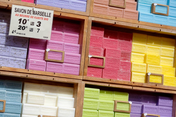 Marseille soap also called Savon de Marseille Nice, France - May 11, 2014: Marseille soap also called Savon de Marseille, put up for sale at the market, traditional soap made from vegetable oils, under the same name produces for about 600 years savon stock pictures, royalty-free photos & images