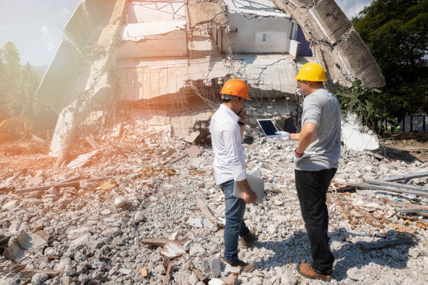 istock Demolition control supervisor and foreman discussing on demolish building. 1198075467