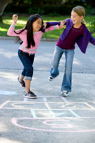 istock Girls playing hopscotch 119807558