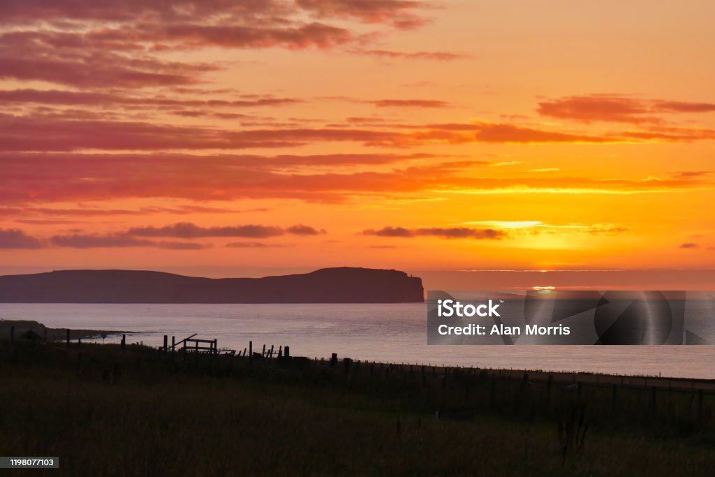 Sunset over Dunnet Head in Caithness, Scotland, UK Sunset over Dunnet Head in Caithness, Scotland, UK, taken in September Beach Stock Photo