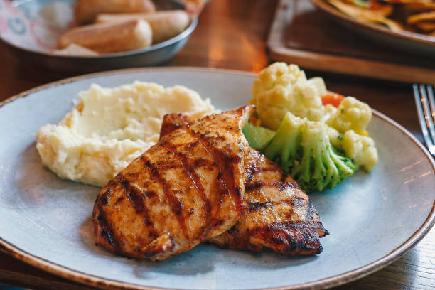 istock Roasted chicken breast with salad on plate 1198077889