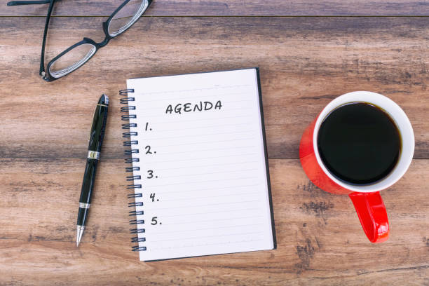 Agenda text on notepad Agenda text on notepad - business concept meeting agenda stock pictures, royalty-free photos & images