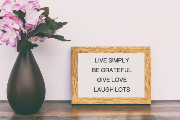 istock Quotes - Live simply, be grateful, give love, laugh lots. 1198079648