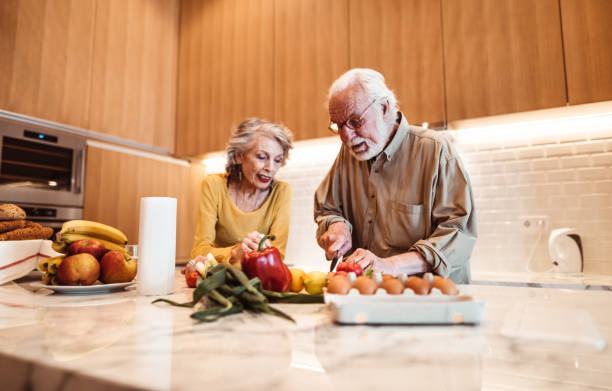 istock senior couple cooking in the kitchen 1198081365