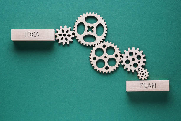 istock Abstract background with connected gears working together, from idea to plan. Business concept. 1198082422