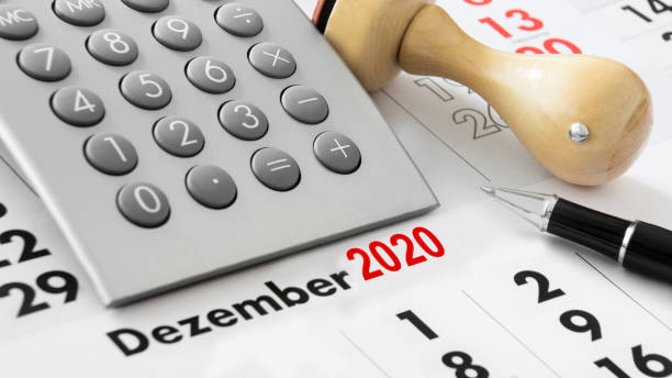 istock Calendar and calculator and German: December 2020 1198082619