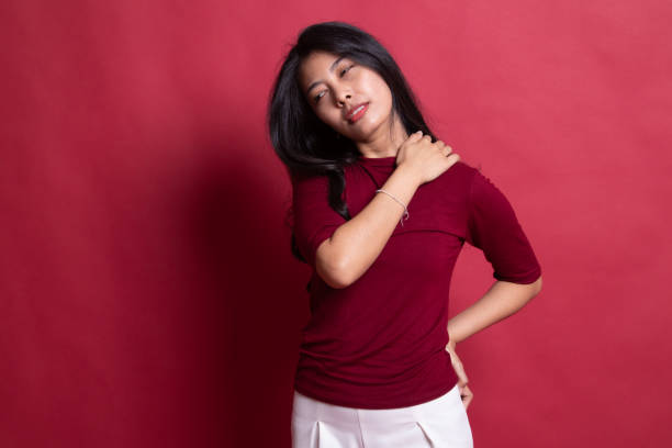 istock Young Asian woman got back pain. 1198085516