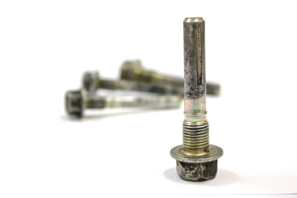 Old front brake caliper guide pin on white background, isolated, Car service.
